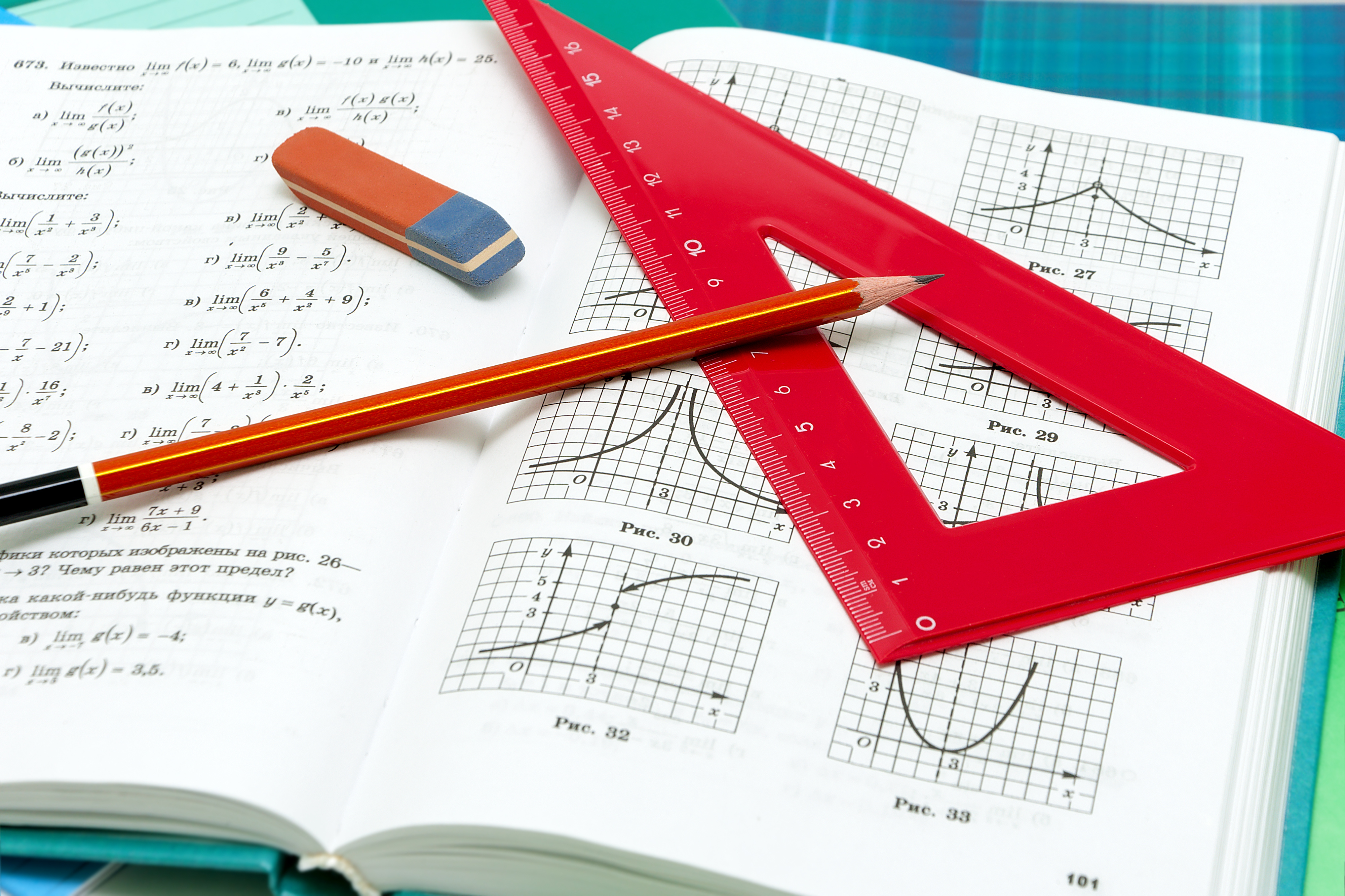 Paper, pencil, ruler and book